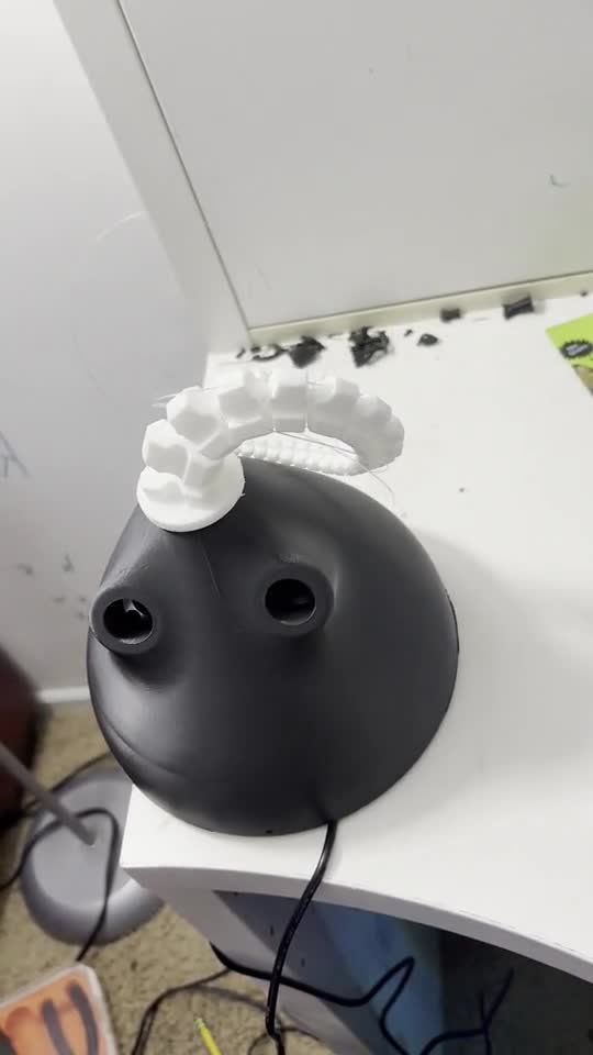 Cable-driven soft robot arm on the workbench